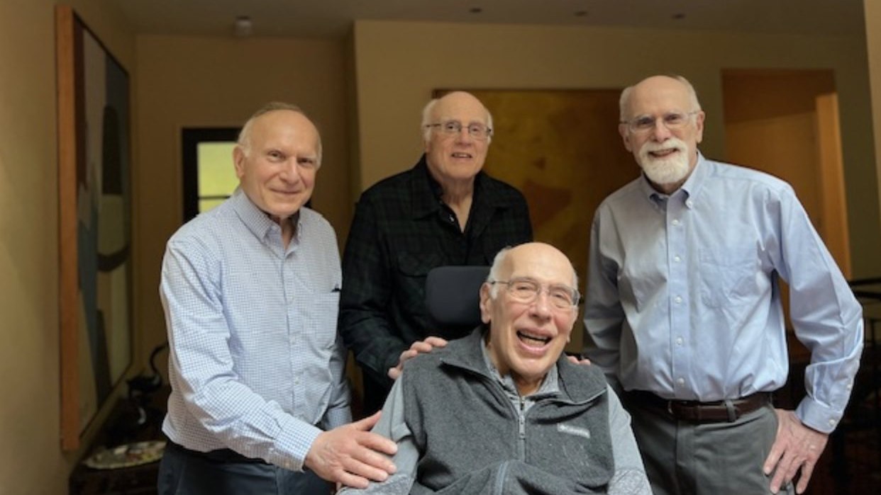 James Rosenbaum with his three brothers, gathered in a living room